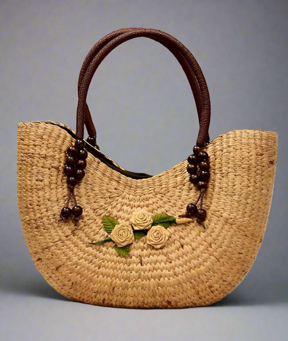 Crafted from eco-friendly woven material, this bag features a unique design highlighted by beautiful wooden bead details and a delicate floral accent. The neutral tones and organic texture give it a timeless, bohemian vibe that pairs perfectly with both casual and chic outfits.Crafted from eco-friendly woven material, this bag features a unique design highlighted by beautiful wooden bead details and a delicate floral accent. The neutral tones and organic texture give it a timeless, bohemian vibe that pairs
