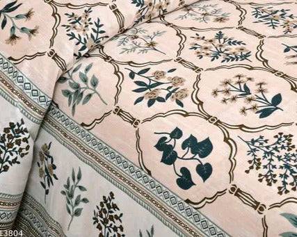 Floral and geometric patterned fabric with green and brown colors on a beige background