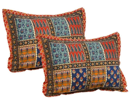 Two decorative pillows with intricate patterns on a white background