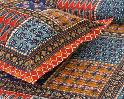 Colorful patterned fabric with intricate designs in red, blue, and orange.