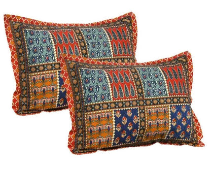 Two decorative pillows with intricate patterns on a white background